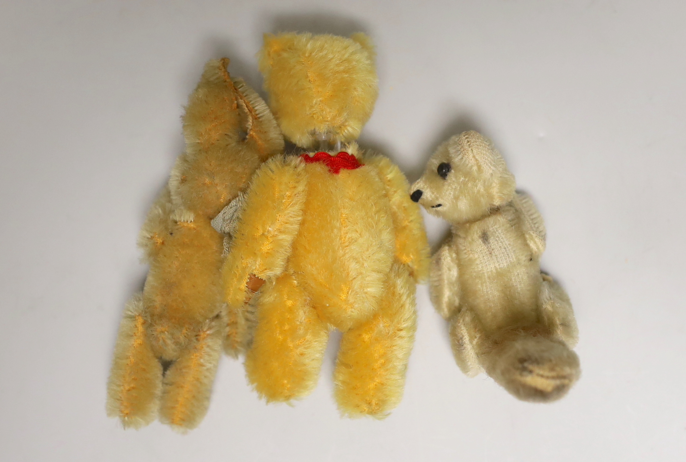 A modern Schuco scent bottle bear, 5in., a Schuco rabbit, 3in., and a Schuco possum